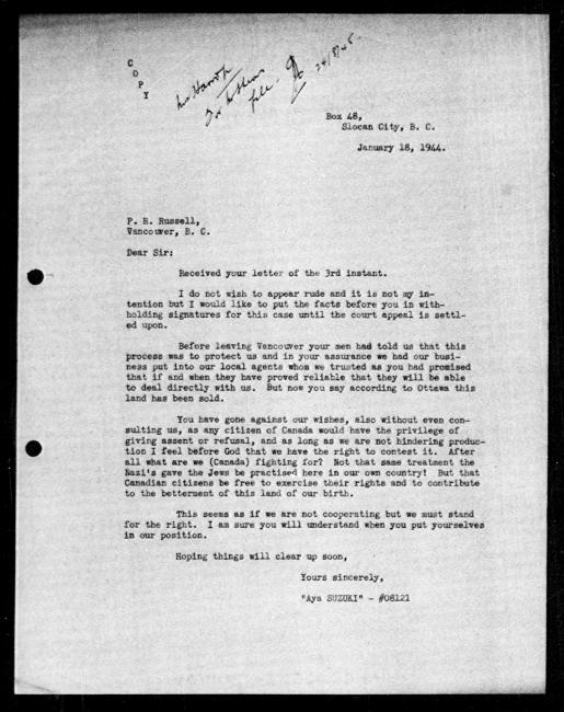 Scanned black-and-white microfilm of a typewritten copy of a letter to government representative P. H. Russell from Aya Suzuki regarding dispossession of their property. Handwritten annotation reads it was received 1945-8-24.