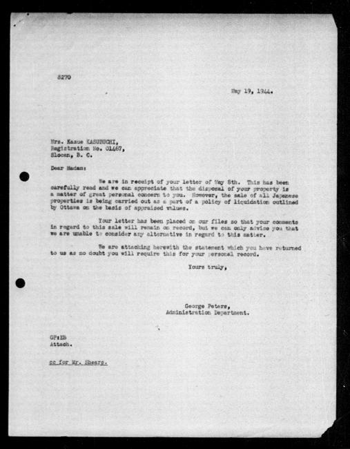 Scanned black-and-white microfilm of a typed reply letter to Kazue Kasubuchi from government representative George Peters regarding dispossession of their property.