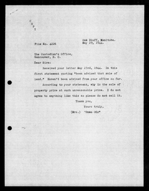 Scanned black-and-white microfilm of a typewritten copy of a letter addressed to the government from Umeo Oka regarding dispossession of their property.