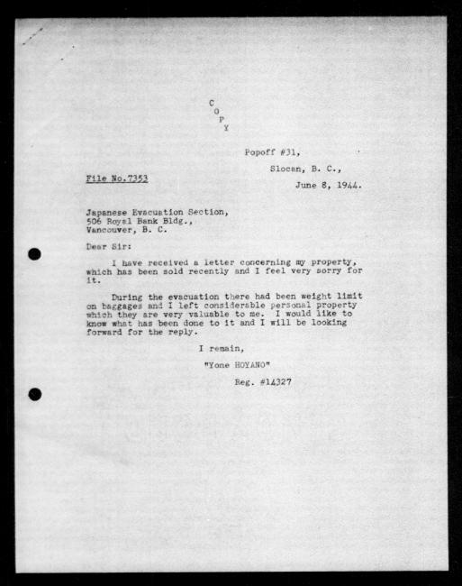 Scanned black-and-white microfilm of a typewritten copy of a letter addressed to the government from Yone Hoyano regarding dispossession of their property.