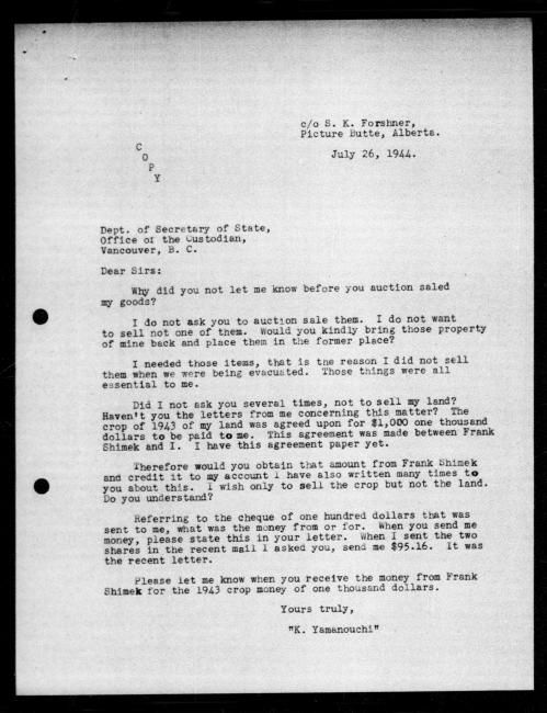 Scanned black-and-white microfilm of a typewritten copy of a letter addressed to the government from   Keiji Yamanouchi regarding dispossession of their property.
