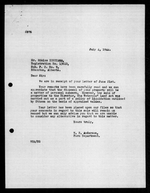 Scanned black-and-white microfilm of a typewritten reply letter to Rikizo Yoneyama from government representative WE Anderson regarding dispossession of their property.