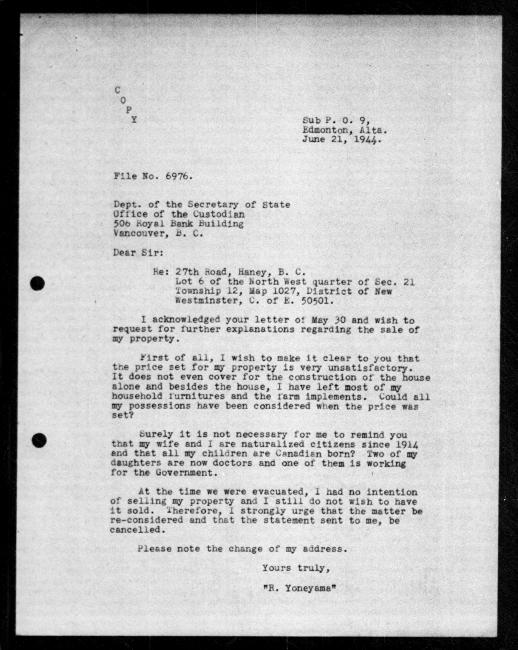 Scanned black-and-white microfilm of a typewritten copy of a letter addressed to the government from Rikizo Yoneyama regarding dispossession of their property.