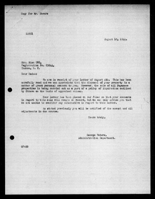 Scanned black-and-white microfilm of a typewritten reply letter to Risa Ono from government representative WE Anderson regarding dispossession of their property.