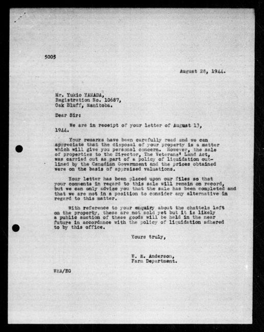 Scanned black-and-white microfilm of a typewritten reply letter to Yukio Yamada from government representative WE Anderson regarding dispossession of their property.