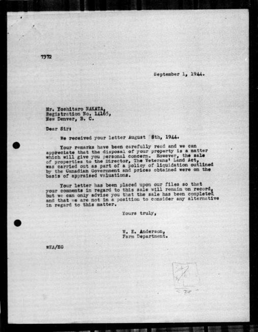 Scanned black-and-white microfilm of a typed reply letter to Yoshitaro Nakata from government representative WE Anderson regarding dispossession of their property. Handwritten markings on bottom right of page.