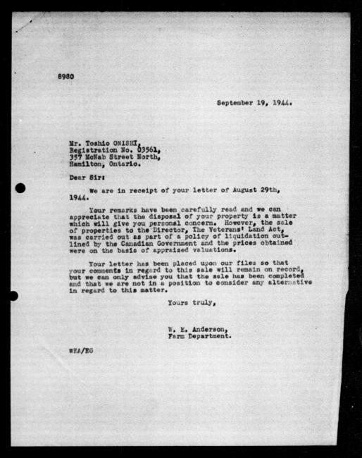 Scanned black-and-white microfilm of a typed reply letter to Toshio Onishi from government representative WE Anderson regarding dispossession of their property.
