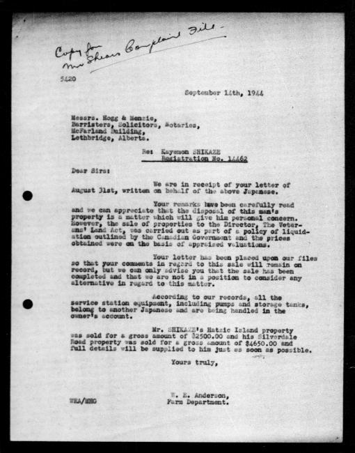 Scanned black-and-white microfilm of a typed reply letter to Kayemon Shikaze from government representative WE Anderson regarding dispossession of their property. Handwritten comment on top left page.
