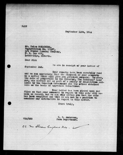 Scanned black-and-white microfilm of a typewritten reply letter to Teizo Nakashima from government representative WE Anderson regarding dispossession of their property. Includes handwritten annotation with checkmark in the bottom margin.