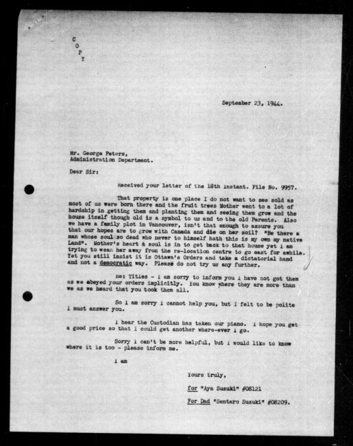 Scanned black-and-white microfilm of a typewritten copy of a letter addressed to the government representative George Peters from Aya and Sentaro Suzuki regarding dispossession of their property.