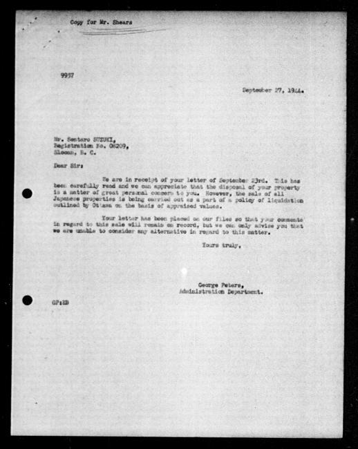 Scanned black-and-white microfilm of a typewritten reply letter to Aya and Sentaro Suzuki from government representative George Peters regarding dispossession of their property.