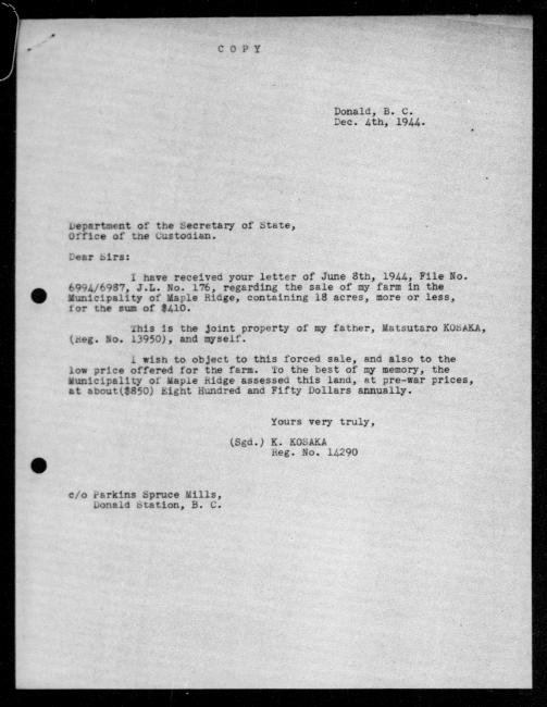 Scanned black-and-white microfilm of a typewritten copy of a letter addressed to the government from Matsutaro and Kensuke Kosaka regarding dispossession of their property.