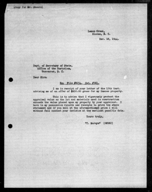 Scanned black-and-white microfilm of a typewritten copy of a letter addressed to the government from Toru Maruya regarding dispossession of their property.