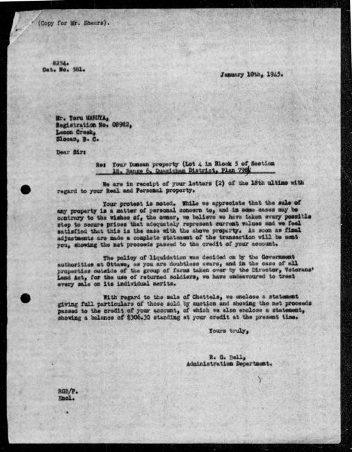 Scanned black-and-white microfilm of a typed reply letter to Toru Maruya from government representative RG Bell regarding dispossession of their property.