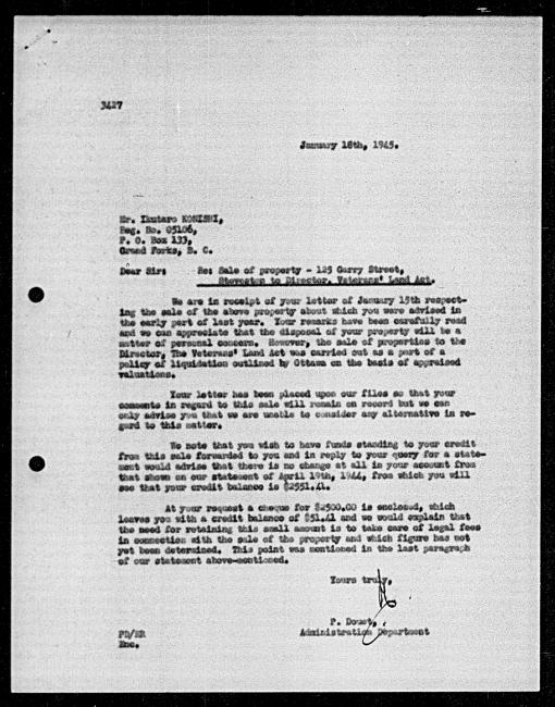 Scanned black-and-white microfilm of a typewritten reply letter to Ikutaro Konishi from government representative P Douet regarding dispossession of their property.