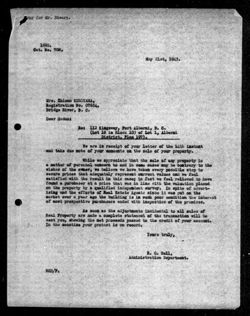Scanned black-and-white microfilm of a typed reply letter to Chieno Kuroyama from government representative RG Bell regarding dispossession of their property.