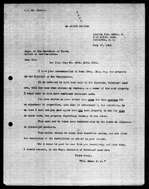 Scanned black-and-white microfilm of a typewritten copy of a letter addressed to the government from  Private SM Omura regarding dispossession of their property.