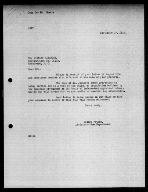 Scanned black-and-white microfilm of a typewritten reply letter to Shotaro Nakamura from government representative George Peters regarding dispossession of their property.