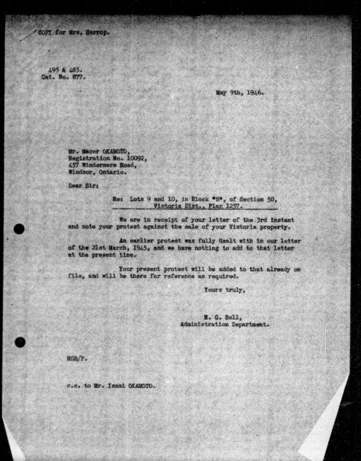 Scanned black-and-white microfilm of a typed reply letter to Macer Okamoto from government representative RG Bell regarding dispossession of their property.