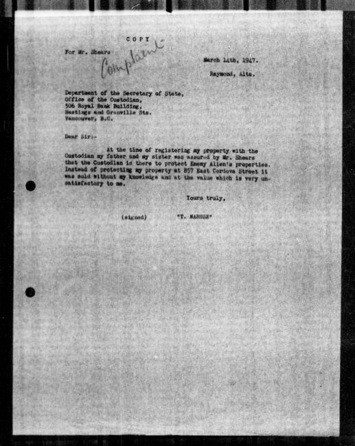 Un microfilm noir et blanc scanné d'une copie dactylographiée d'une lettre adressée au gouvernement de T Naruse concernant la dépossession de sa propriété. Il y a une annotation manuscrite.