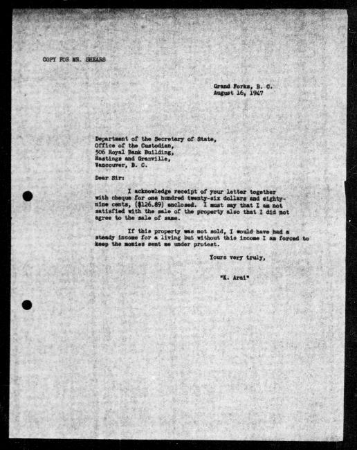 Un microfilm noir et blanc scanné d'une copie dactylographiée d'une lettre adressée au gouvernement de K Arai concernant la dépossession de sa propriété.