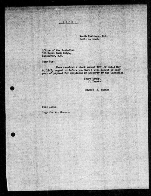 Un microfilm noir et blanc scanné d'une copie dactylographiée d'une lettre adressée au gouvernement de J Tanaka concernant la dépossession de sa propriété.
